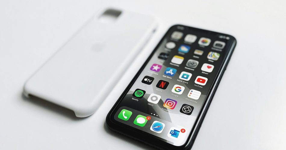 Smartphone on wooden table - digital minimalism, decluttering apps, productivity concept